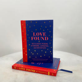 Two stacked books with blue and red covers titled Love Found