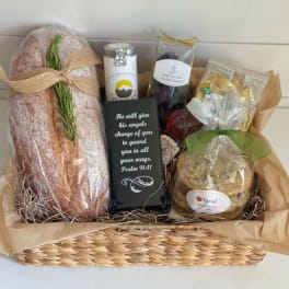 Gift basket with bread, cookies, chocolates, and a scripture plaque