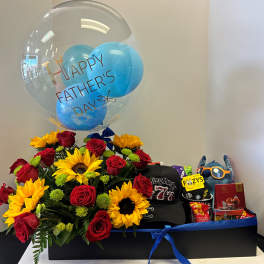Gift box with red roses, sunflowers, balloons, and Father's Day items