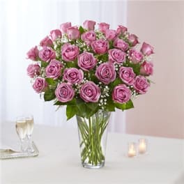 Pink rose bouquet in a clear glass vase