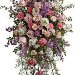 Tall standing floral spray with pink and lavender roses