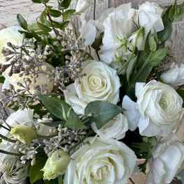 White rose bouquet with white lisianthus and greenery