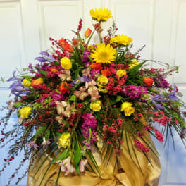 Large mixed bouquet with yellow sunflowers and colorful blooms