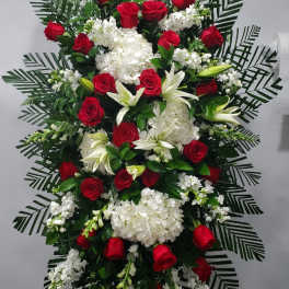 Standing floral spray with red roses and white blooms