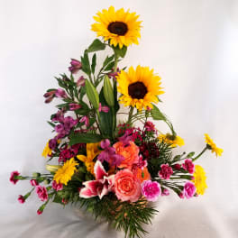 Tall bouquet with sunflowers, roses, lilies, and pink alstroemeria