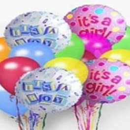 Cluster of colorful birthday balloons with printed messages