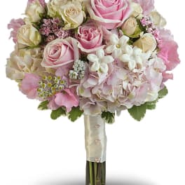 Pink and cream rose bouquet with hydrangea and small white flowers