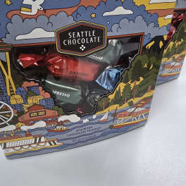 Box of Seattle Chocolate assorted truffles with colorful city-themed packaging