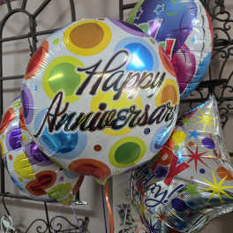 Colorful birthday balloons with "Happy Anniversary" text