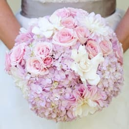 Round bouquet of pale pink roses and white flowers
