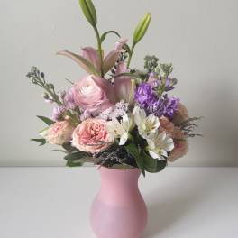 Pink and white mixed bouquet in a pink vase