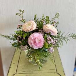 Pink ranunculus bouquet in a clear glass vase