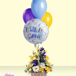 Basket of flowers with balloons, including a baby boy balloon