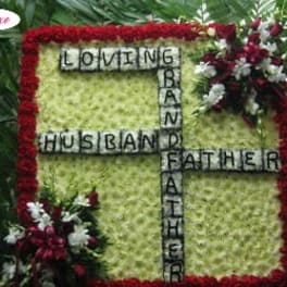 Floral tribute with the words Loving Husband Father