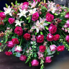 Large arrangement of pink roses and white lilies
