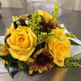 Yellow rose bouquet with dark ribbon and small filler flowers