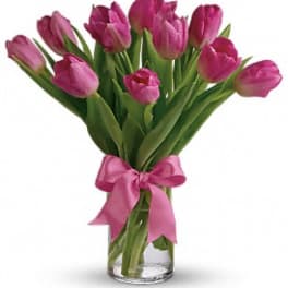 10 Pink Tulips arranged in a vase with a bow.