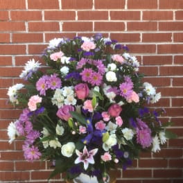 Large mixed floral spray with pink, white, and purple blooms