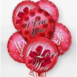 Cluster of red heart-shaped balloons with love messages