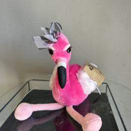 Pink flamingo plush toy with a ribbon bow on its head