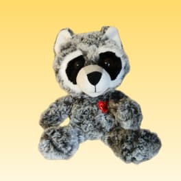 Plush raccoon with a small red heart on its chest
