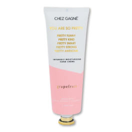Tube of grapefruit hand cream with pink and white packaging