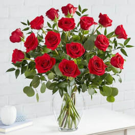Bouquet of red roses in a clear glass vase