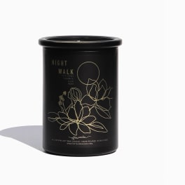 Black candle jar with gold floral line art and Night Walk label