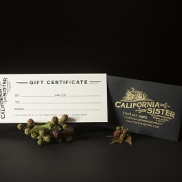 Gift certificate card with a black envelope and small berry sprigs