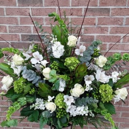 Large white and green floral spray with roses and hydrangeas