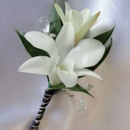 White calla lily boutonniere with black-and-silver wrapped stem
