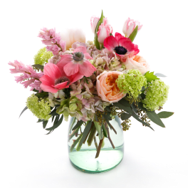 Pink and peach flowers in a clear glass vase