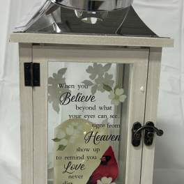 Wooden memorial lantern with a candle and cardinal design