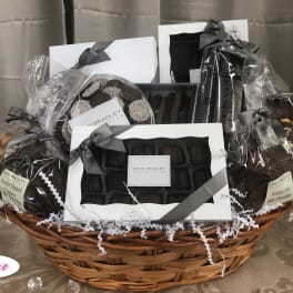 Gift basket with assorted chocolates and cookies in clear wrapping