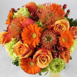 Orange and peach bouquet with gerbera daisies and roses