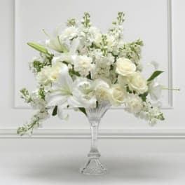 White floral arrangement in a clear glass vase