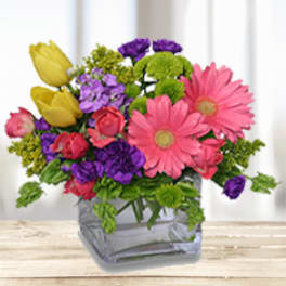 Colorful mixed bouquet in a clear glass vase