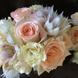 Bouquet of pale peach roses and cream flowers