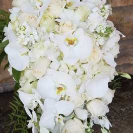 White floral bouquet with orchids and roses