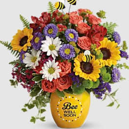Mixed bouquet in a yellow vase with a Bee Well Soon message