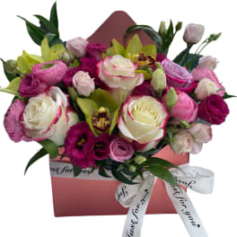 Pink and white rose bouquet in a pink gift box with ribbon