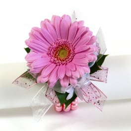 Pink gerbera daisy bouquet with decorative ribbon