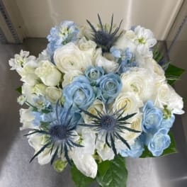 Blue and white bouquet with spiky thistle-like blooms