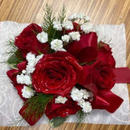 Red rose bouquet with white baby's breath and a red ribbon