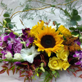 Mixed bouquet with a sunflower, yellow roses, and purple orchids