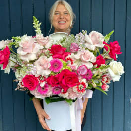 Large bouquet of pink and white roses with gerbera daisies in a white box