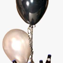Balloon bouquet with champagne bottles in a gold bucket