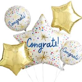 Cluster of congratulatory foil balloons in gold and white