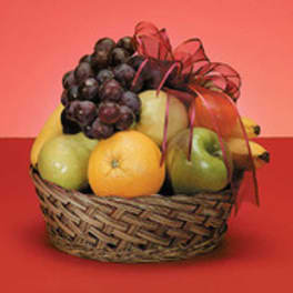Basket of assorted fruit with a red ribbon