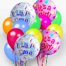 Cluster of colorful balloons with "it's a boy" and "it's a girl" messages